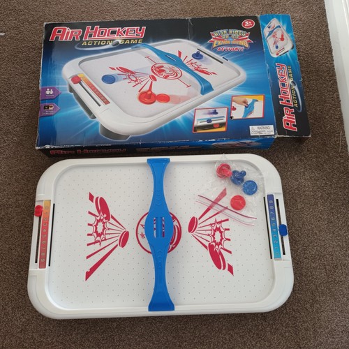 Air hockey table top action - air,